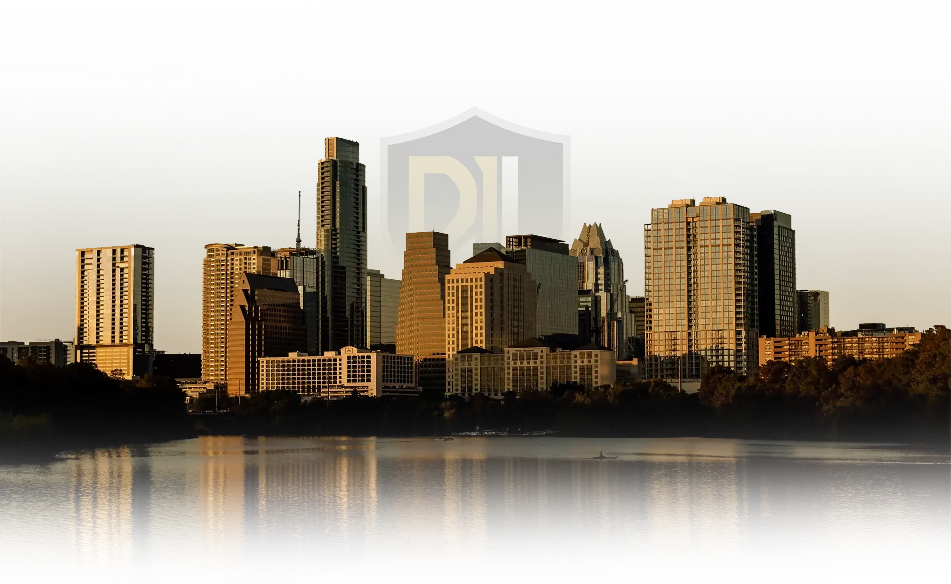 Austin, Texas skyline reflected on the Colorado River at sunset